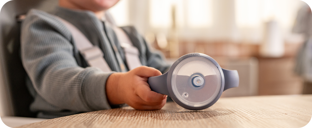 Closeup of bottle with baby